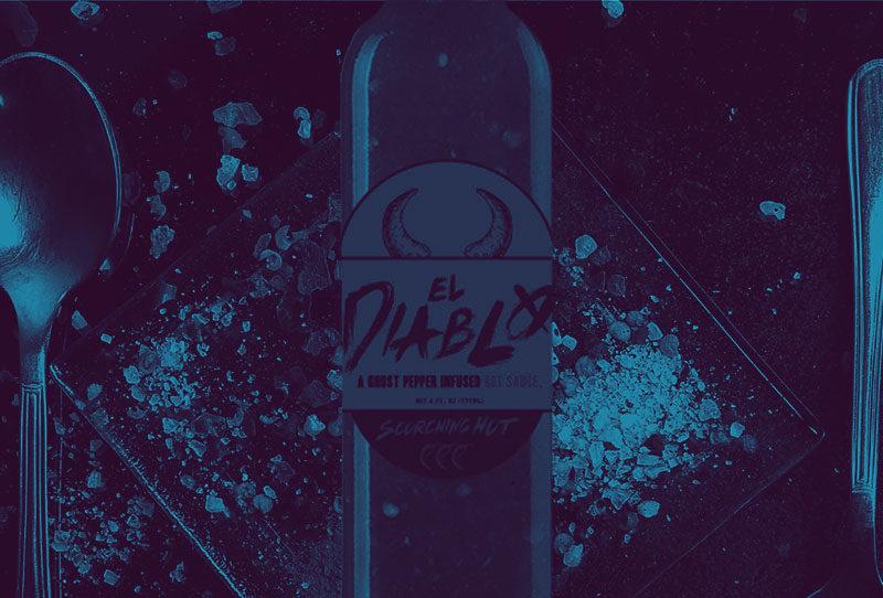 El Diablo sauce bottle over plate of salt and spices