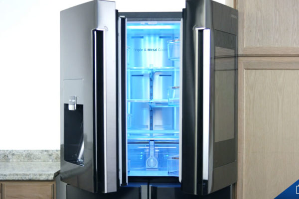 Samsung refrigerator opening next to cabinets