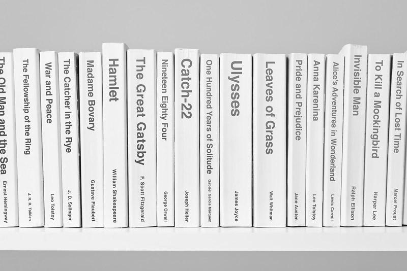 Assorted classic books on shelf in black and white
